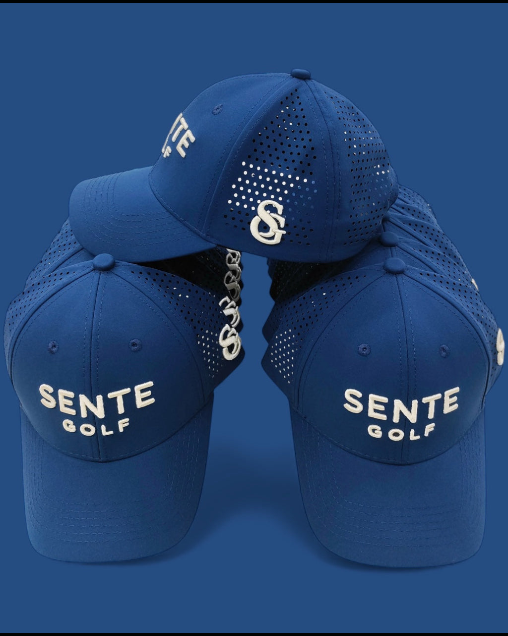 Blue baseball caps with 'Sente Golf' branding on a blue background