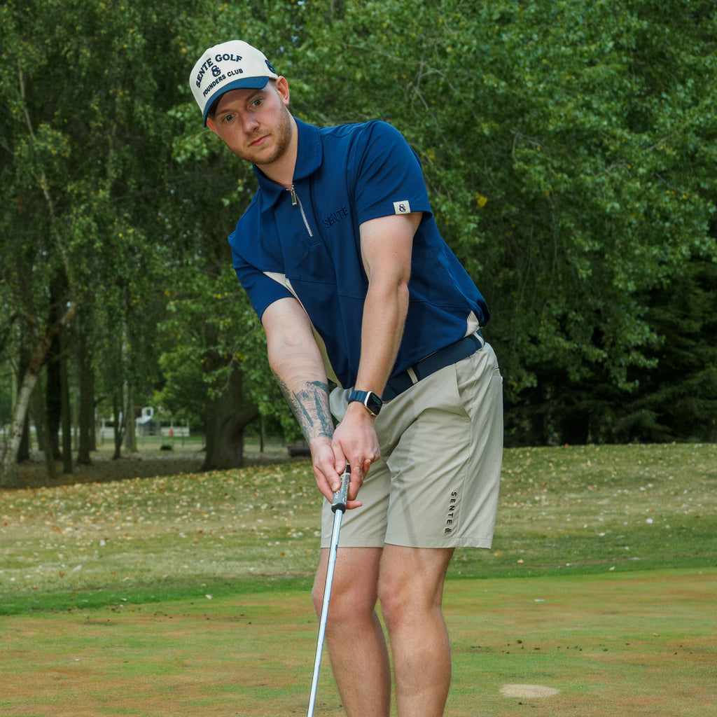 Golfer wearing the SENTE Signature Polo on the course
