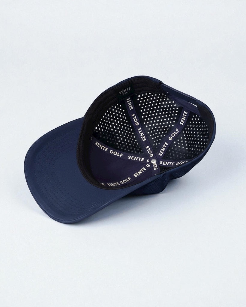 Navy blue cap with black mesh back on a light gray background