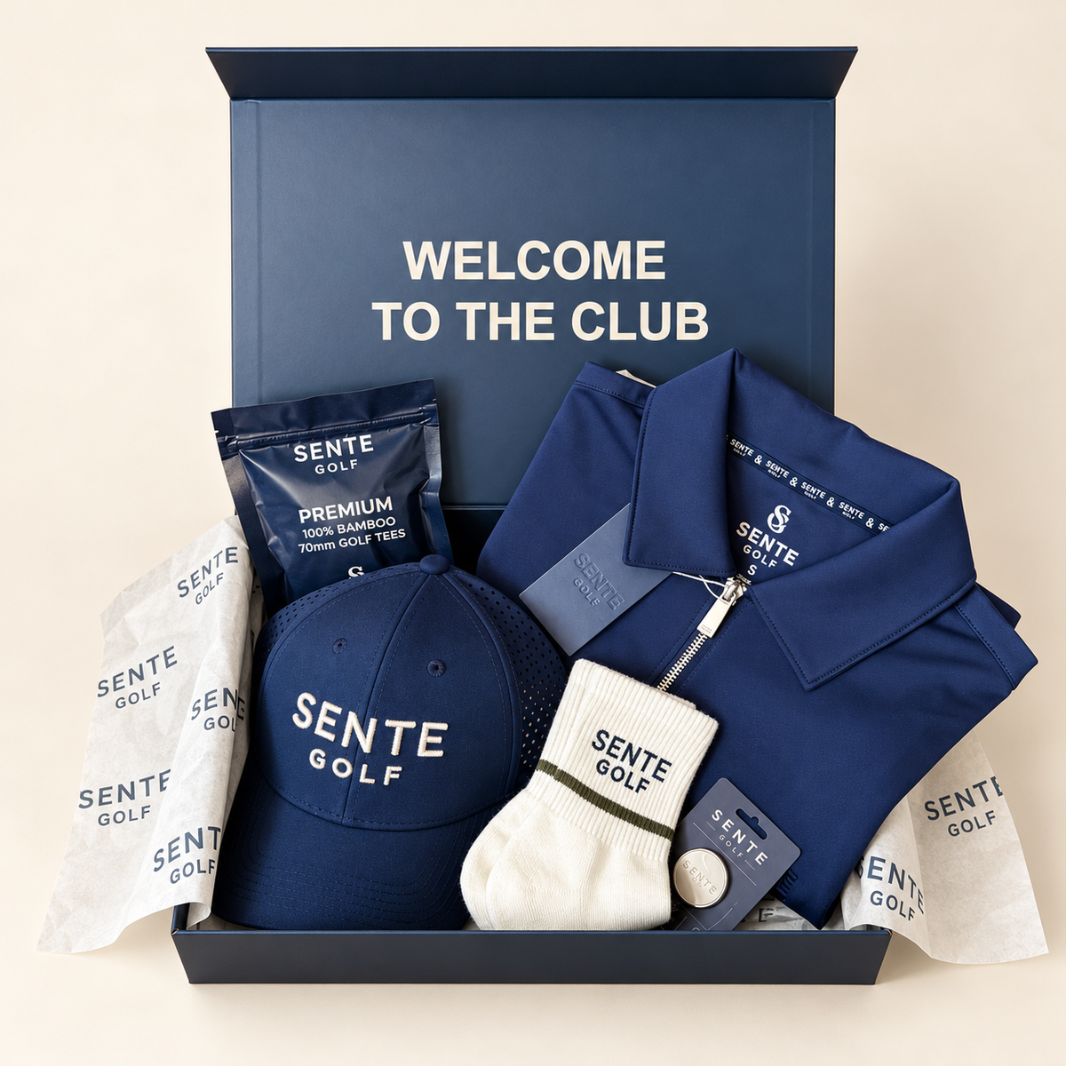 SENTE First-Tee Ready Kit with Signature Polo, cap, ball marker, tees and Core golf socks in a presentation box