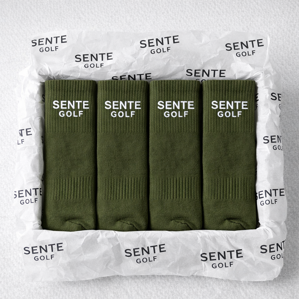 Four green golf socks in a clear package with 'Sente Golf' branding.