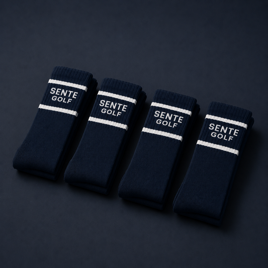Four pairs of navy blue socks with 'Sente Golf' branding on a dark background